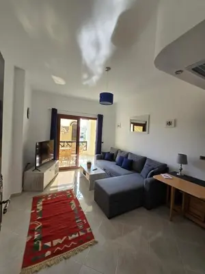 a living room with a couch and a table at Ferienwohnung Sahl Hasheesh in Hurghada