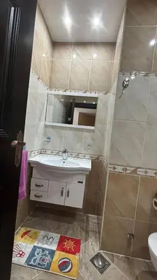 a bathroom with a sink and a shower at Ferienwohnung Sahl Hasheesh in Hurghada