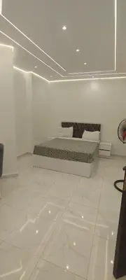 a bedroom with a bed in a white room at Juliana Beach Resort Hurghada D402 in Hurghada