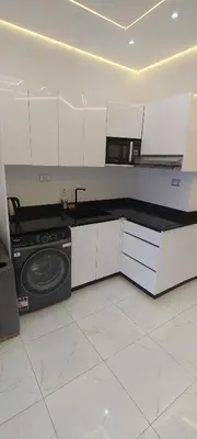 a kitchen with a stove and a microwave in it at Juliana Beach Resort Hurghada D402 in Hurghada