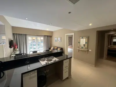 a kitchen with a black counter top in a room at Elegant 2BR Apartment • Ocean View Abu Tig Marina in Hurghada