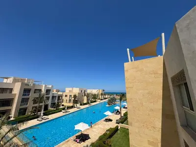 a view of a swimming pool at a resort at 3 Bdr Sea View with private roof Mangrovy EL Guna in Hurghada