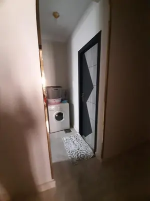 a bathroom with a mirror and a toilet in a room at Horus Heights in Idfu