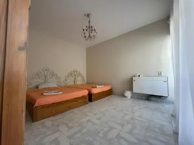 a small bedroom with a bed and a tv at 4 Bedroom Seaside Hurghada Escape in Hurghada