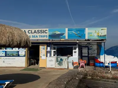 a building with a sign that reads classic and sea trips at 4 Bedroom Seaside Hurghada Escape in Hurghada