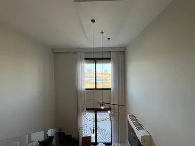 a room with a window and a chandelier at Bohemian-Style 3BR Townhouse in Shedwan, El Gouna. in Hurghada