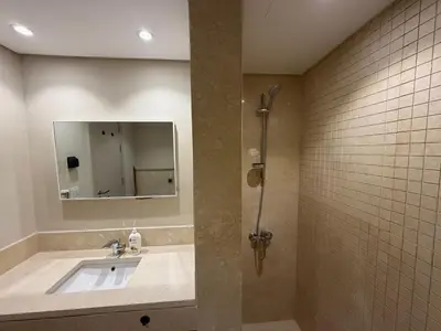 a bathroom with a sink and a mirror at Cozy 1BR GF Mangroovy Residence in Hurghada