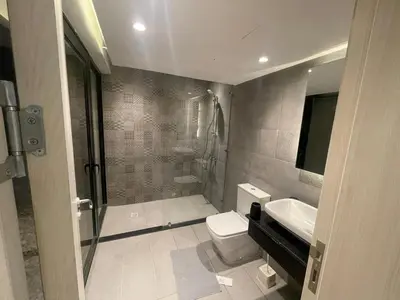 a bathroom with a shower and a toilet and a sink at Luxurious 5bdrooms villa Somabay in Hurghada