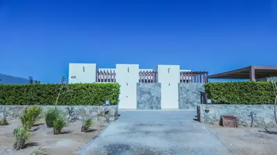 a white building with a pathway in front of it at Luxurious 5bdrooms villa Somabay in Hurghada