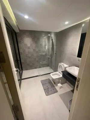 a bathroom with a shower and a toilet and a sink at Luxurious 5bdrooms villa Somabay in Hurghada