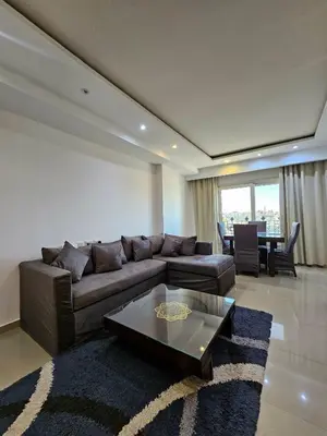a living room with a couch and a table at touristic center in Hurghada