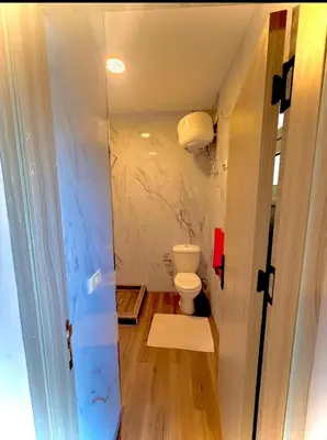 a bathroom with a toilet in a room at Luxury flat in Hurghada