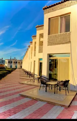 a row of benches in front of a building at Luxury flat in Hurghada