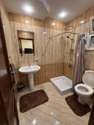 a bathroom with a sink and a toilet and a shower at Studio in Hurghada