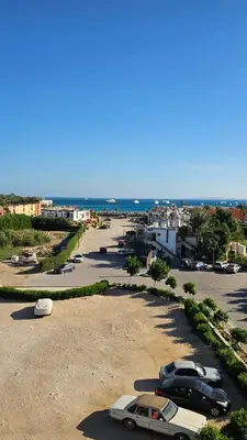 a group of cars parked in a parking lot at Hurghada 201 in Hurghada