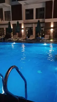 a swimming pool at a hotel at night at 422batthepavillionImperialHurghada in Hurghada