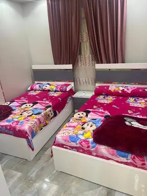 two beds with hello kitty comforters are in a bedroom at القيادات صف ثاني in Hurghada