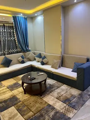 a living room with a couch and a coffee table at القيادات صف ثاني in Hurghada