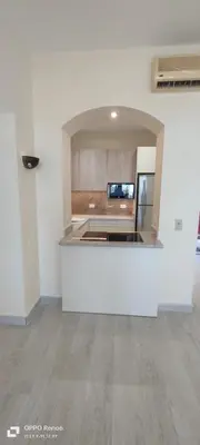an empty kitchen with a counter in a room at West Golf beautiful Townhouse in Hurghada