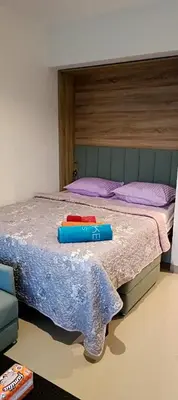 a bed with two containers sitting on top of it at Cozy studio G-cribs elgouna in Hurghada