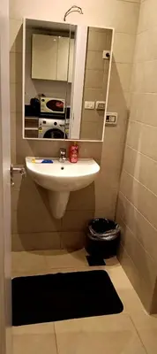 a bathroom with a sink and a mirror at Cozy studio G-cribs elgouna in Hurghada