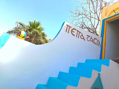 a person riding a snowboard on a ramp at a skate park at Shellaly Ca Nubian Guest2 House in Jazīrat Salūjah