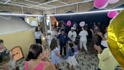 a group of people standing in a room at 2 Karima house B in Al Aqālitah