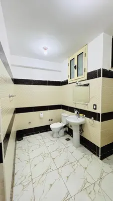 a bathroom with a sink and a toilet at Many hahaha in Luxor