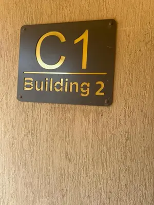 a sign on a wall that reads building at Hurghada Apartment with pool in Hurghada