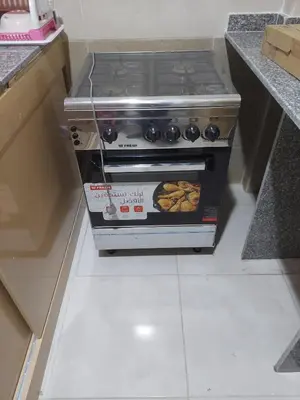 a stove in a kitchen with food inside of it at Hurghada Apartment with pool in Hurghada