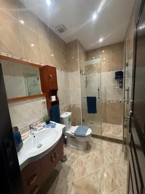 a bathroom with a toilet and a sink and a shower at Sahl Hasheesh Finest Chalet - Gravity resort beachfront family 2 bedroom - garden pools view waterpark NON EGYPTIAN ONLY in Hurghada