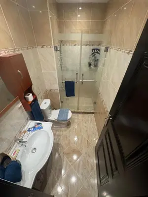 a bathroom with a shower and a sink and a toilet at Sahl Hasheesh Finest Chalet - Gravity resort beachfront family 2 bedroom - garden pools view waterpark NON EGYPTIAN ONLY in Hurghada