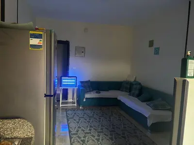 a living room with a couch and a table at El nour in Hurghada