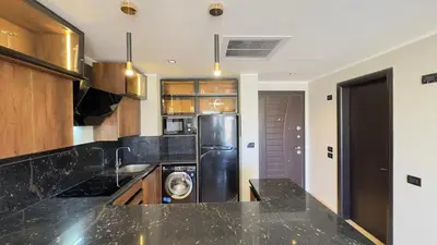 a kitchen with a washer and dryer in it at Galaxy Aldau Hieghts in Hurghada