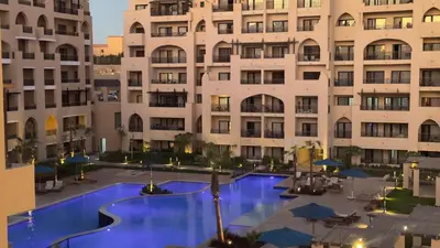 a view of a pool in front of a building at Galaxy Aldau Hieghts in Hurghada