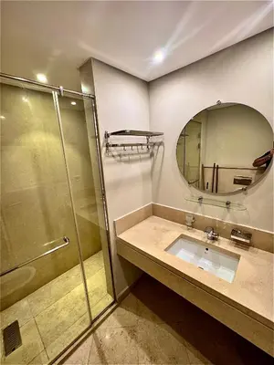 a bathroom with a shower and a sink and a mirror at Mangarove m3 1c 11 in Hurghada