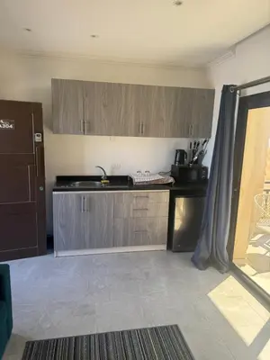 a kitchen with a sink and a counter top at 304 aqua blue bay in Hurghada
