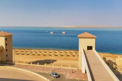 a bridge over a body of water with boats in the water at The View Hurghada Poolfront Sea View Apartment in Hurghada