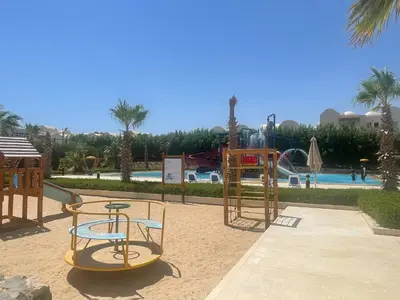 a playground at a resort with a pool at Casa Seherezade in Hurghada