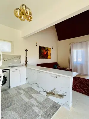 a kitchen with a white counter top in a room at Casa Seherezade in Hurghada