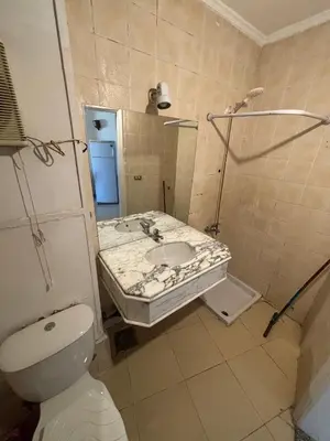 a bathroom with a sink and a shower and a toilet at Bahia Hurghada - 2 Bedrooms Serviced Apartment - City view in Hurghada