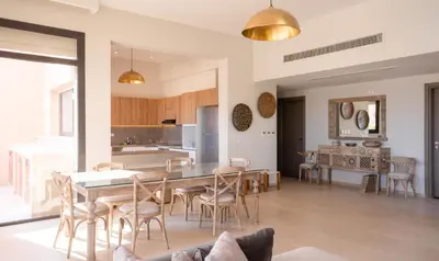 a kitchen and dining room with a table and chairs at Premium 5BR Villa • Heated Pool • Ancient Hill in Hurghada