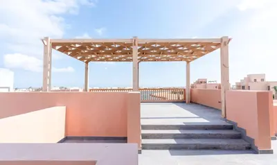 a pergola on the roof of a building with stairs at Premium 5BR Villa • Heated Pool • Ancient Hill in Hurghada