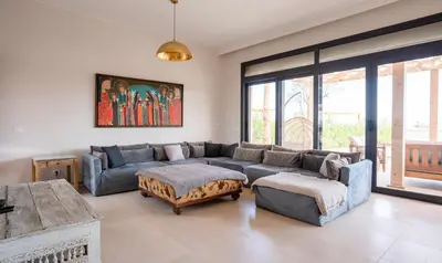 a living room with a couch and a table at Premium 5BR Villa • Heated Pool • Ancient Hill in Hurghada