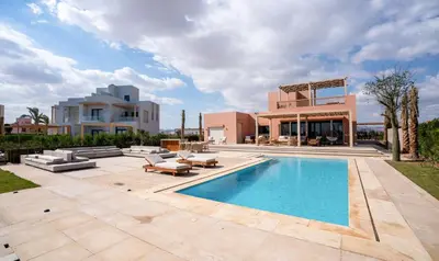 a villa with a swimming pool and a house at Premium 5BR Villa • Heated Pool • Ancient Hill in Hurghada