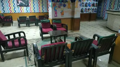 a group of chairs and tables in a room at New mostafa hotel in Luxor