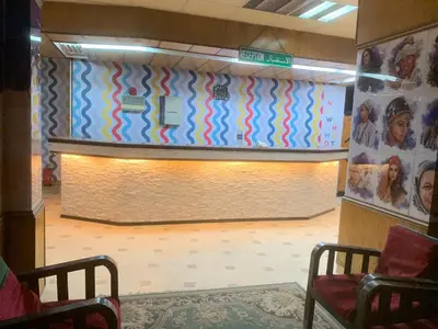 a waiting room with a wall with a stage at New mostafa hotel in Luxor