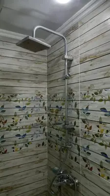 a bathroom with a shower with a fish mural on the wall at Palma chalet 169 in Hurghada