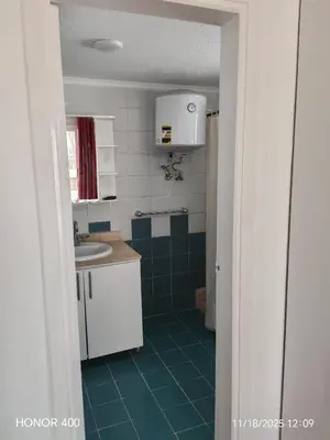 a small bathroom with a sink and a toilet at Elixir Two Bed Rooms in Hurghada