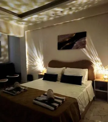 a bedroom with a bed with two towels on it at Pool Dream Hurghada in Hurghada